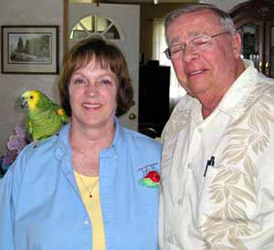 Bonnie and Neil Zurcher with parrot Chico - photo by Debbie Hanson