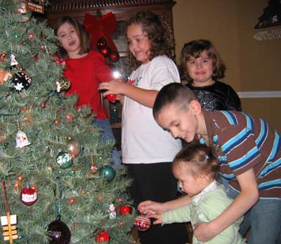 Tim Taylor's grandchildren trimming the tree Christmas 2007