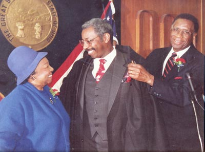 Proud parents Virgil and Lurtissia Brown as Virgil E. Brown Jr. is sworn in as judge